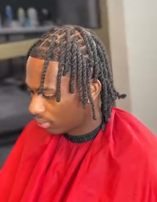 Two-strand twists with a clean parted hairline by AB Fadez