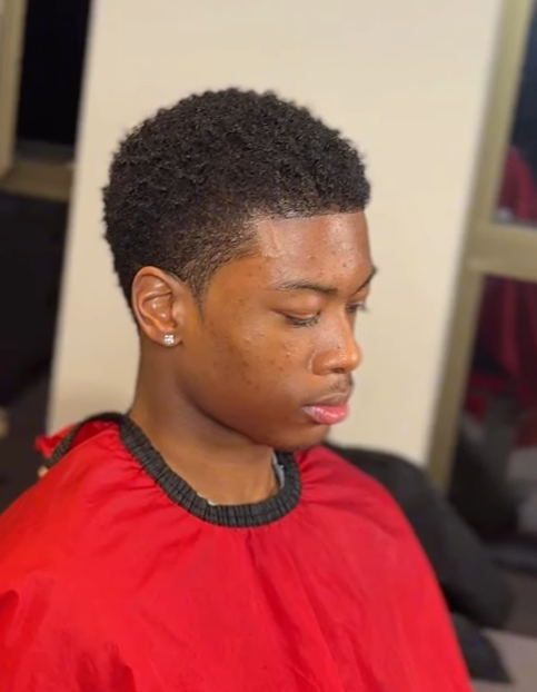 Low taper haircut with clean edges on textured hair by AB Fadez